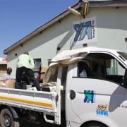 Unloading computers at Epworth Satellite Centre after the Mobile Skills Training in Domboshawa (Vehicle funded by SERVE)-Zim
