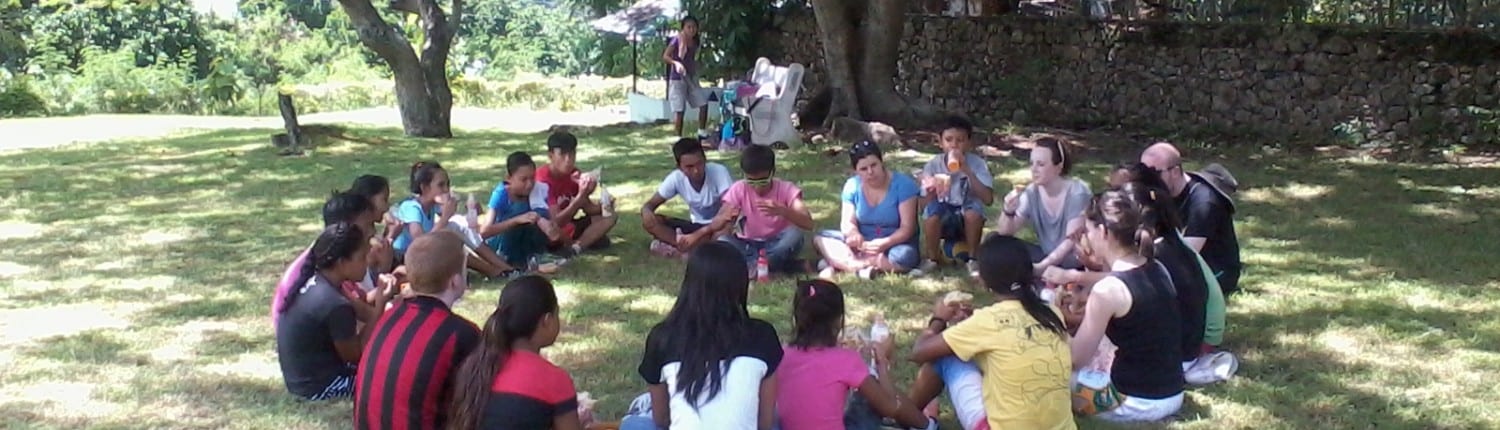 2014 volunteers sharing stories after the sports day in Holy Family Retreat Centre