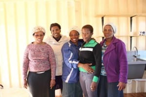 Volunteers from Freedom Park at the new OVC kitchen getting ready to start cooking! #SolidarityInAction, August 2015