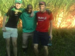 Students from Coláiste Feirste with SERVE leader Vernam Timbini at sugar cane plantation